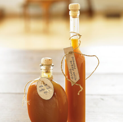 Two decorative jars of syrup