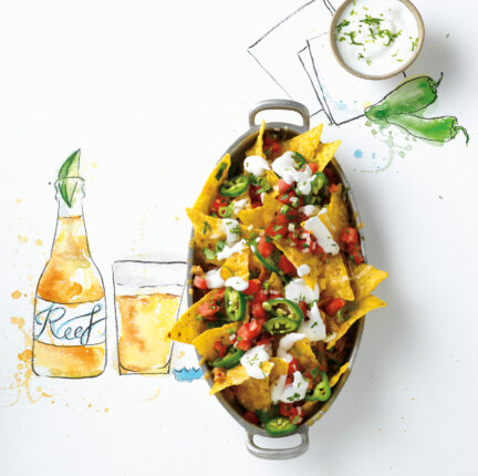 Pan of nachos with a food related illustration